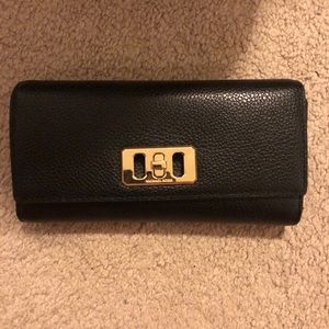 Black trifold Michael Kors wallet